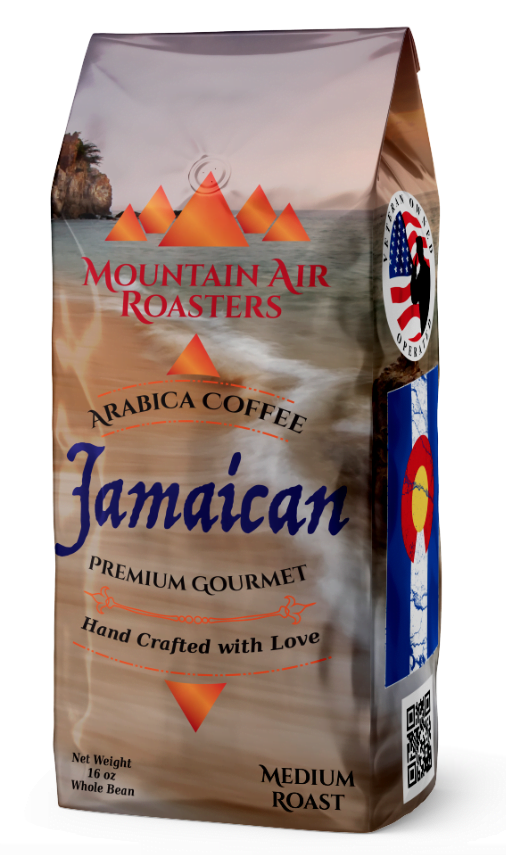 one pound mountain air roasters, jamaican coffee bag. the beach with sand, the ocean with small rustling waves in an isolated cove with pink and purple clouds of evening sunlight
